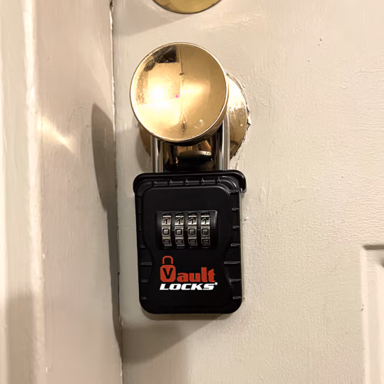 Lockbox for medical alert system mounted on doorknob for quick EMS access